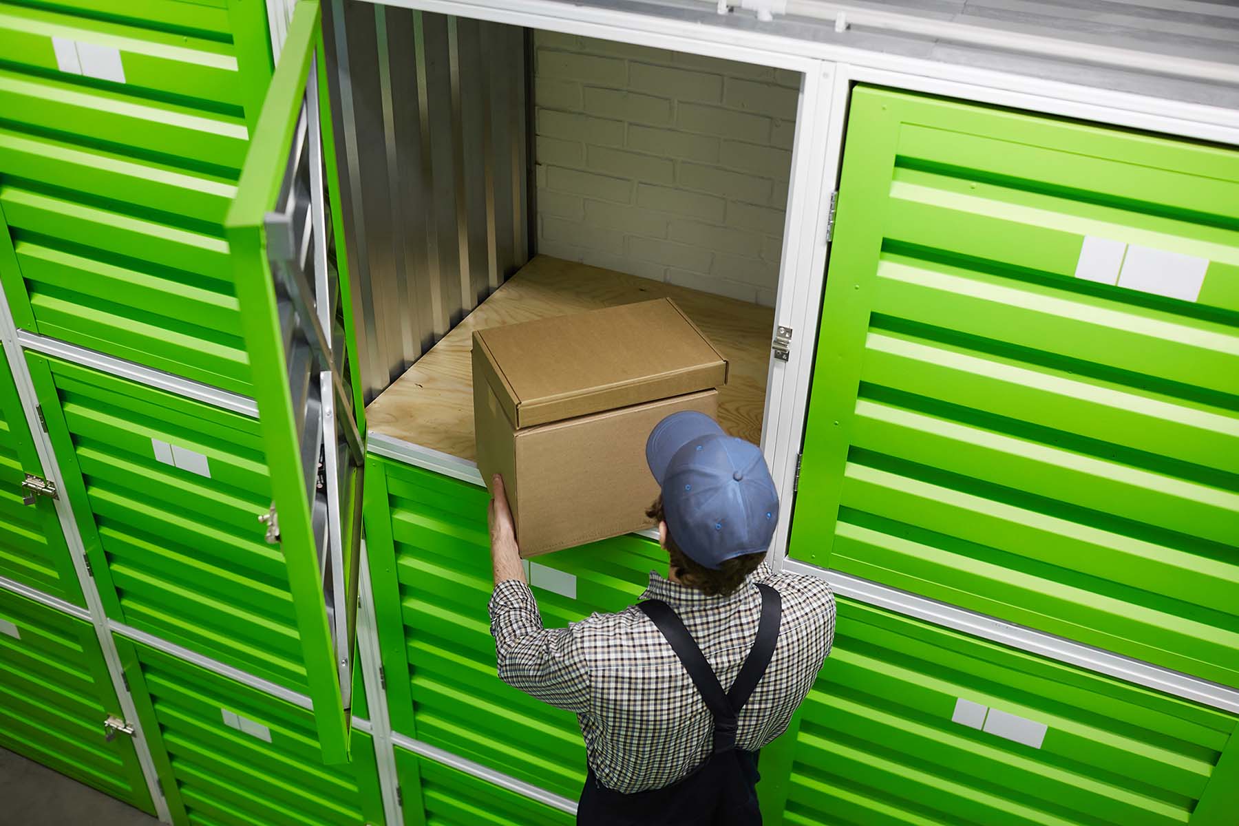 Man packing parcels for amazon wholesale suppliers orders